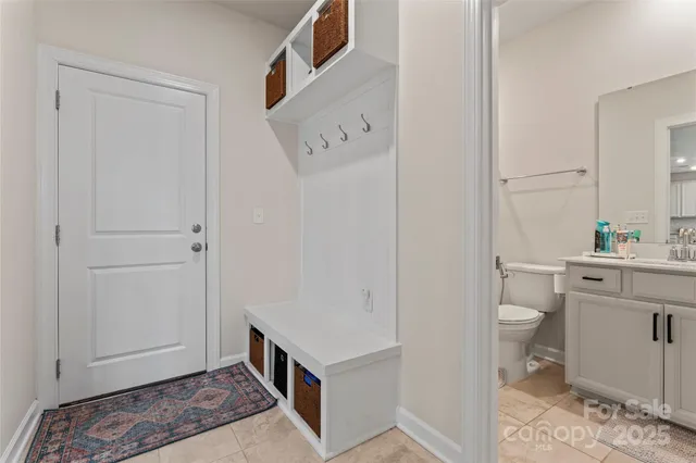 a bathroom with a toilet sink and vanity