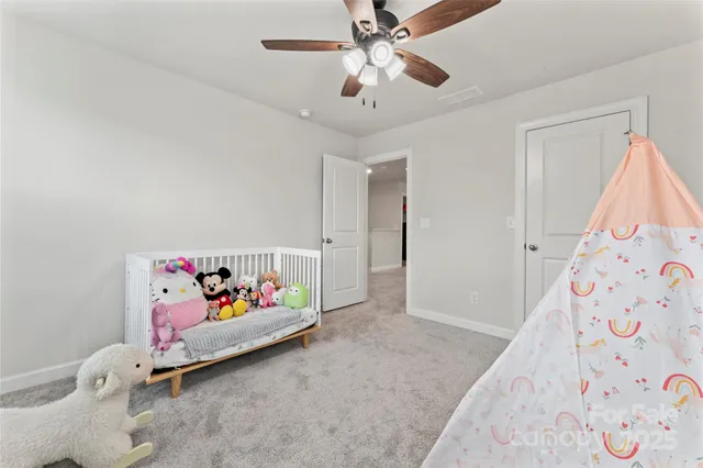 a bathroom with a double vanity sink toilet and a mirror