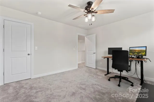 a workspace with furniture and a window