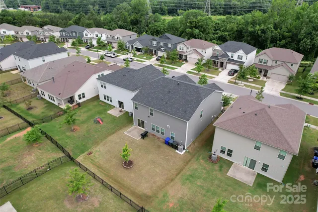 an aerial view of a house with a garden