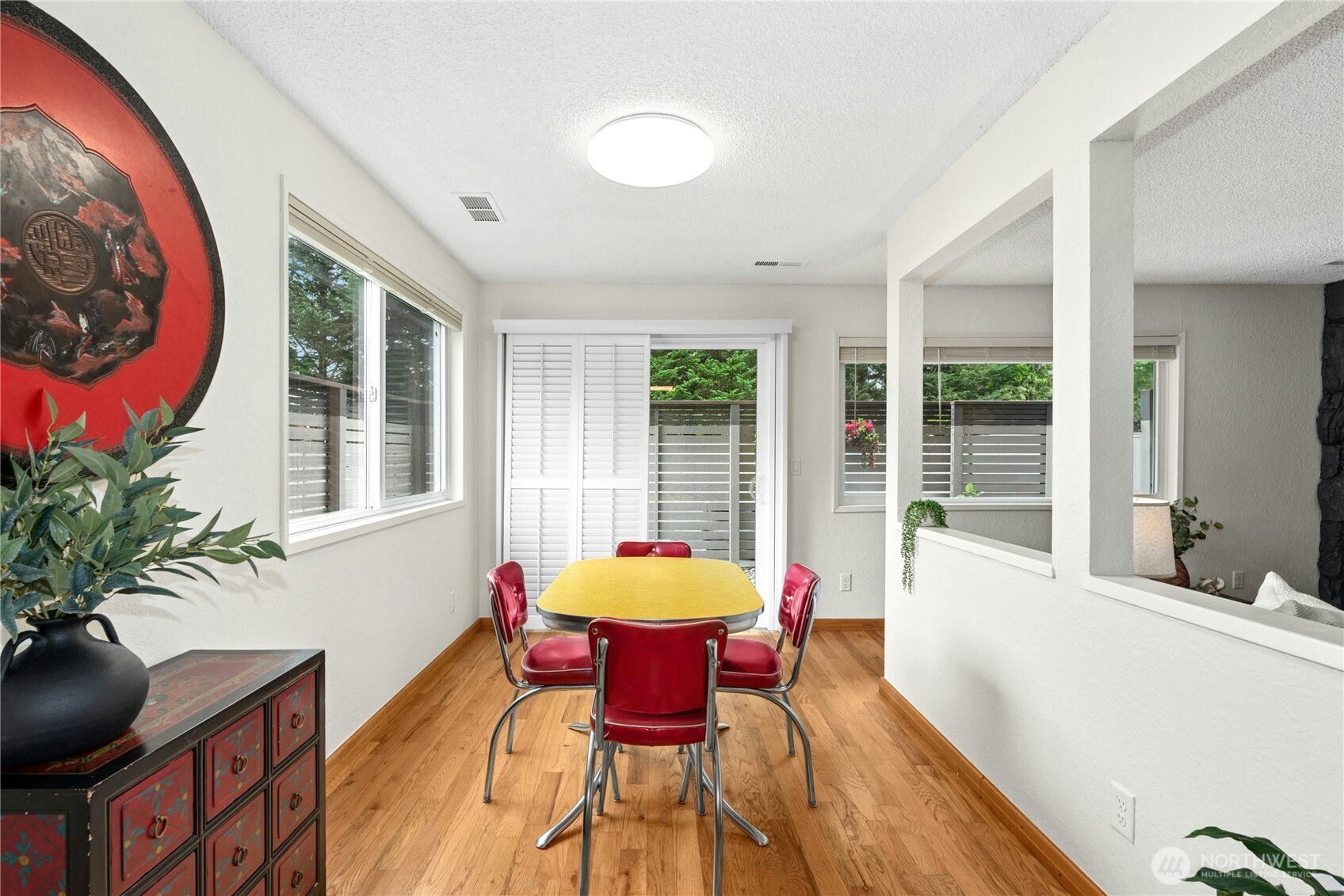 9523 Northeast 180th Street, Unit A102 Bothell, WA 98011 - Photo 9 of 29 a living room with furniture and a large window
