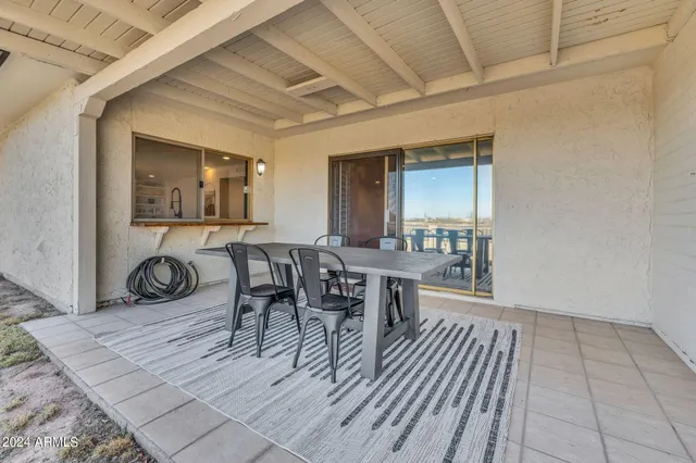 a dining room with furniture and window