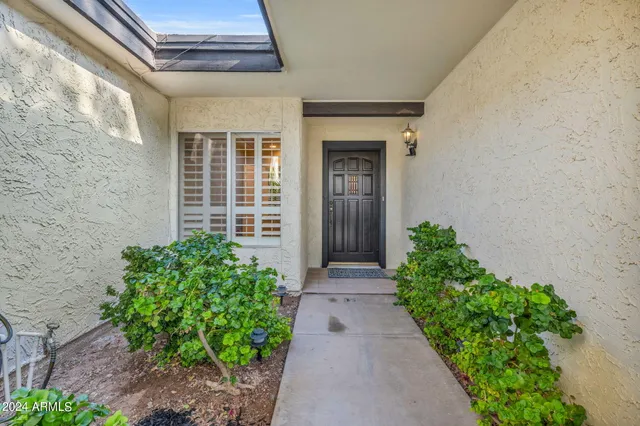 a view of a pathway besides a house