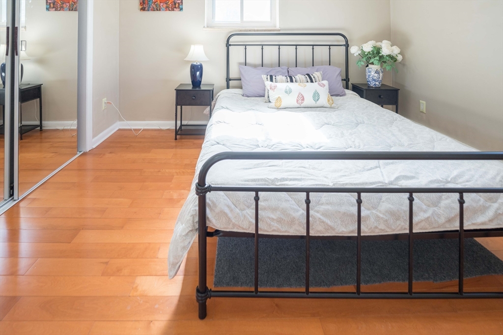 20 Westgate Road, Unit 6 Boston, MA 02467 - Photo 11 of 25 a bedroom with a bed and a window