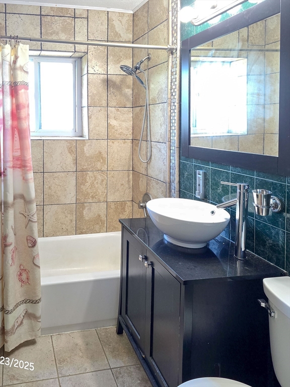 20 Westgate Road, Unit 6 Boston, MA 02467 - Photo 15 of 25 a bathroom with a sink a toilet and bathtub