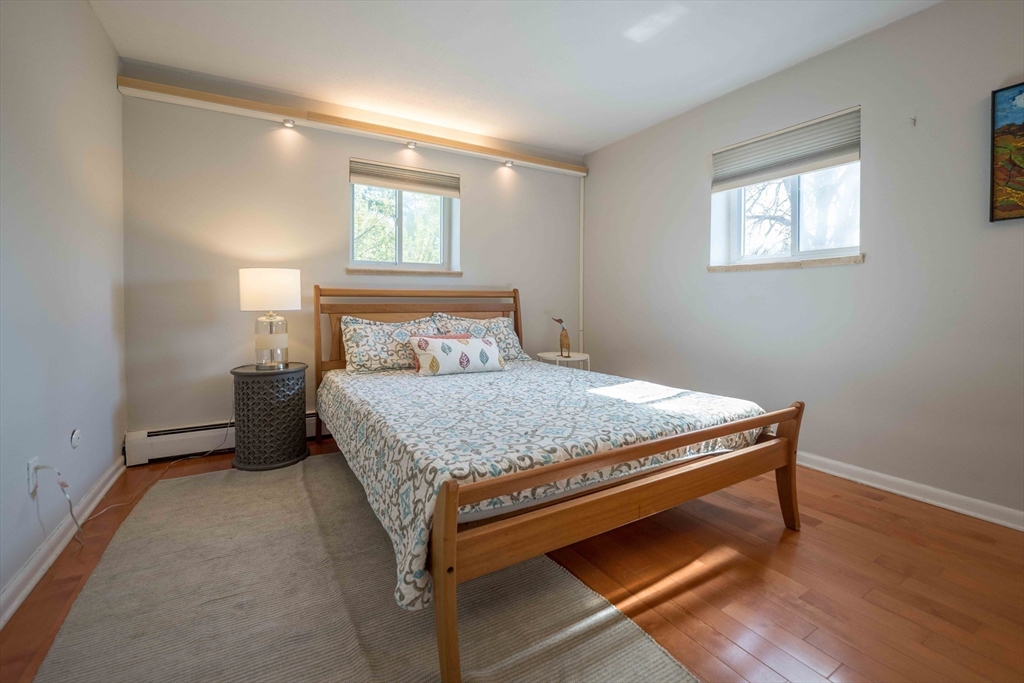 20 Westgate Road, Unit 6 Boston, MA 02467 - Photo 8 of 25 a bedroom with a bed and a window