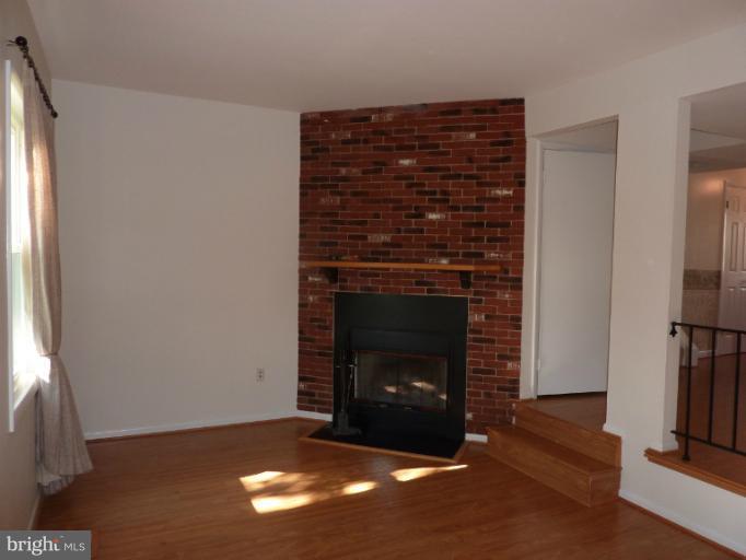 54 Timber Rock Road Gaithersburg, MD 20878 - Photo 4 of 10 a living room with a fireplace