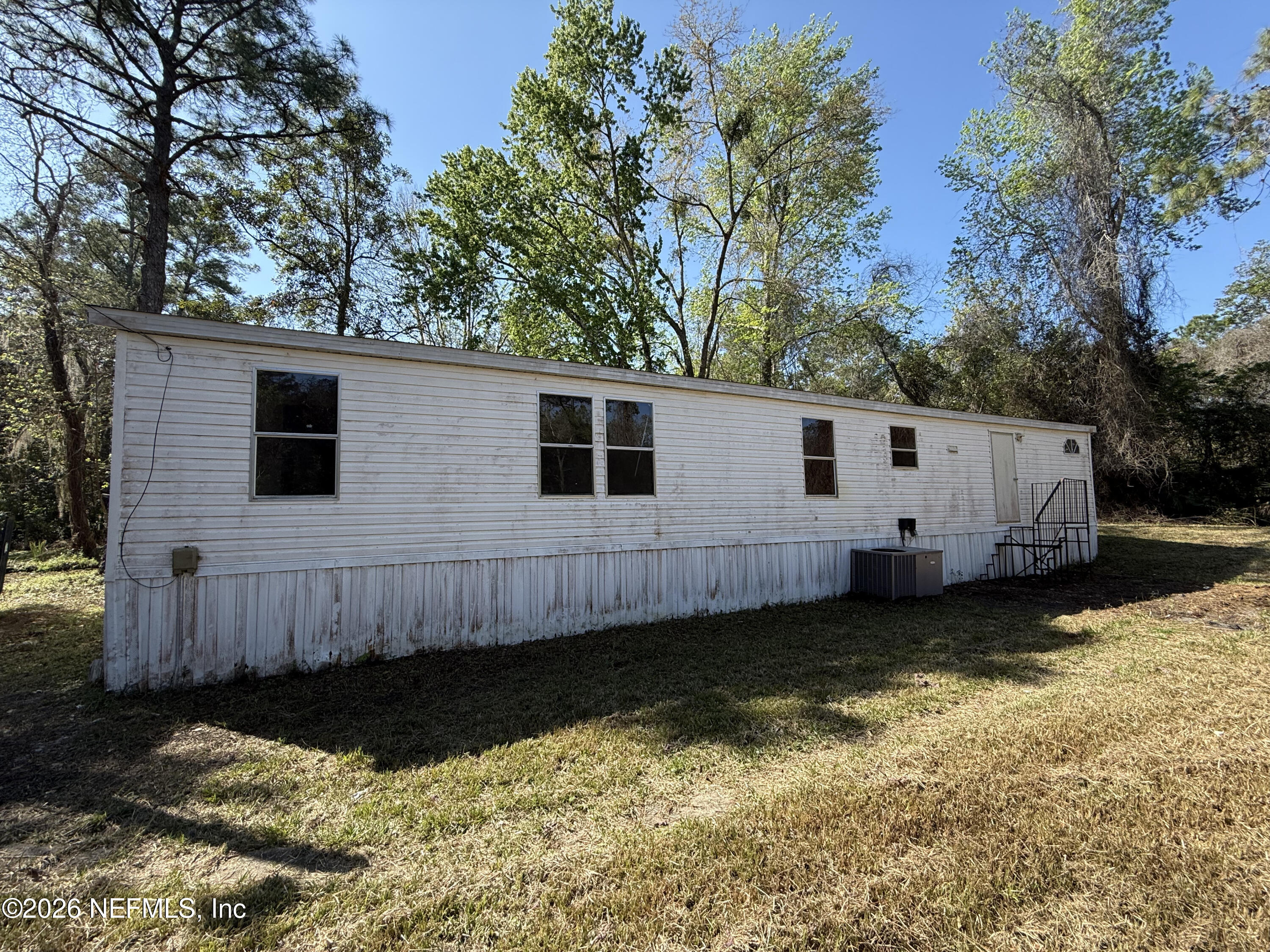 a view of a back yard of the house