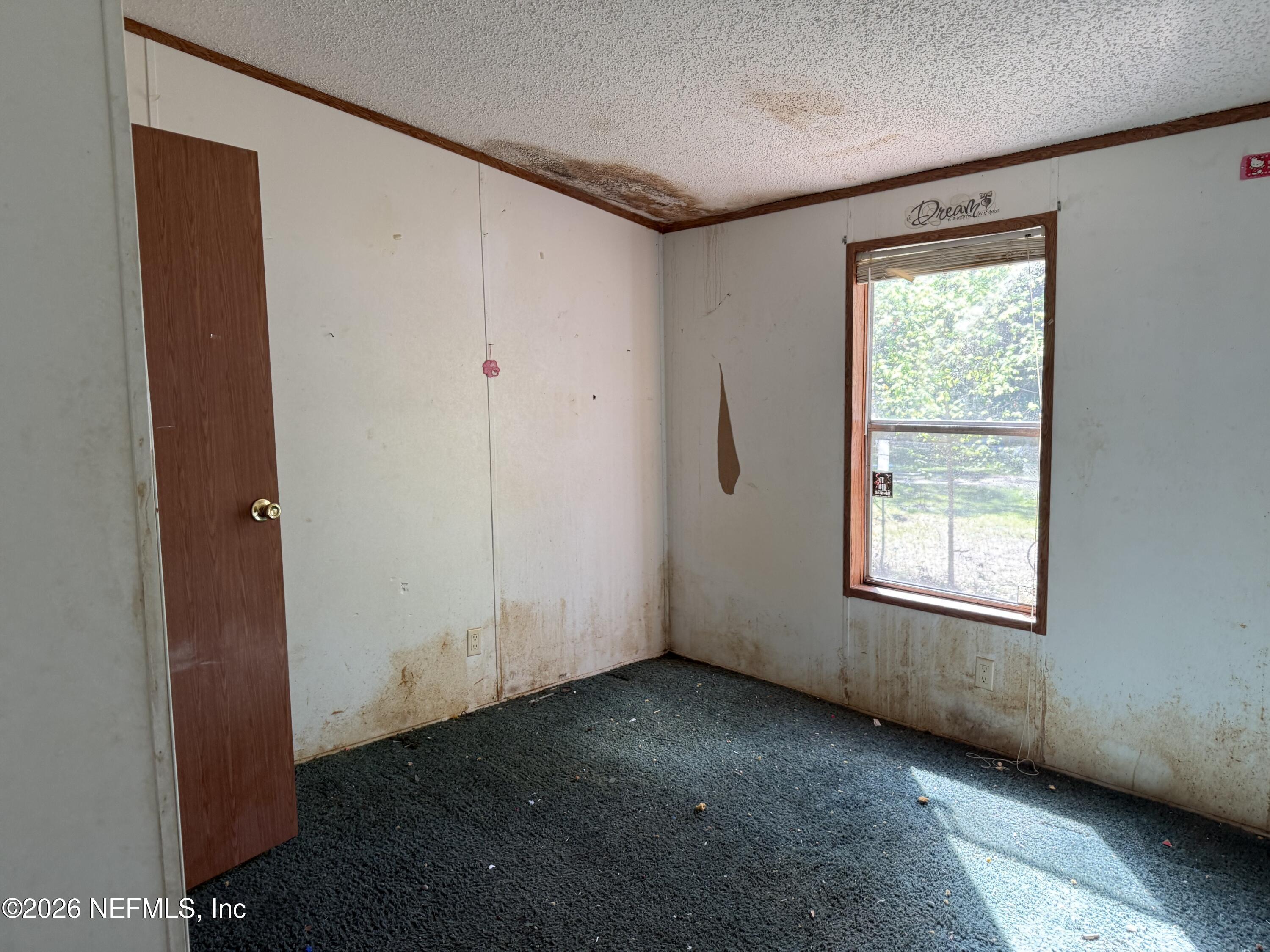 203 Quail Hollow Road Satsuma, FL 32189 - Photo 13 of 15 an empty room with windows