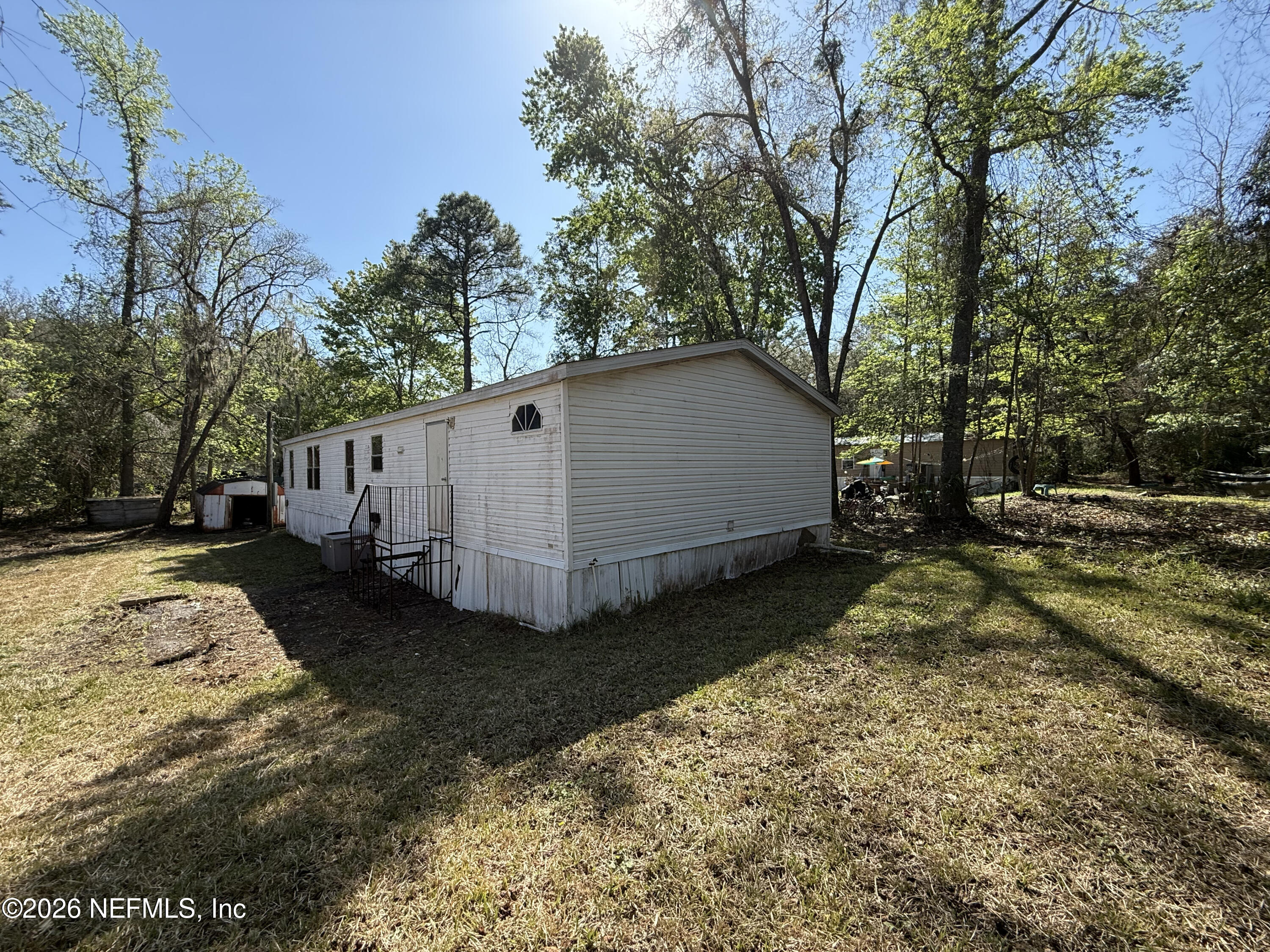 203 Quail Hollow Road Satsuma, FL 32189 - Photo 3 of 15 a view of a house with backyard and trees