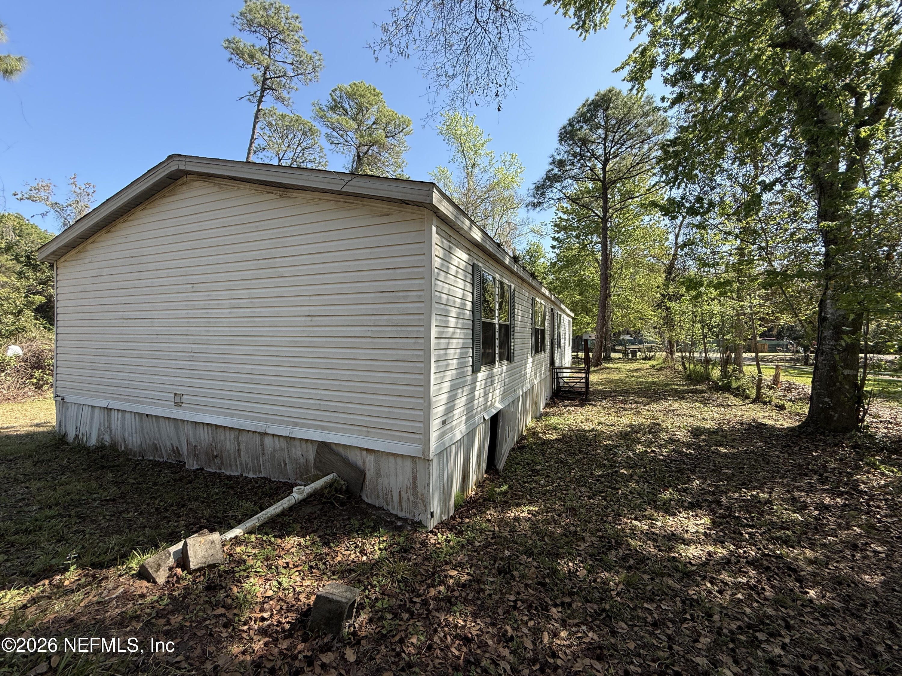 203 Quail Hollow Road Satsuma, FL 32189 - Photo 4 of 15 a view of a house with a yard