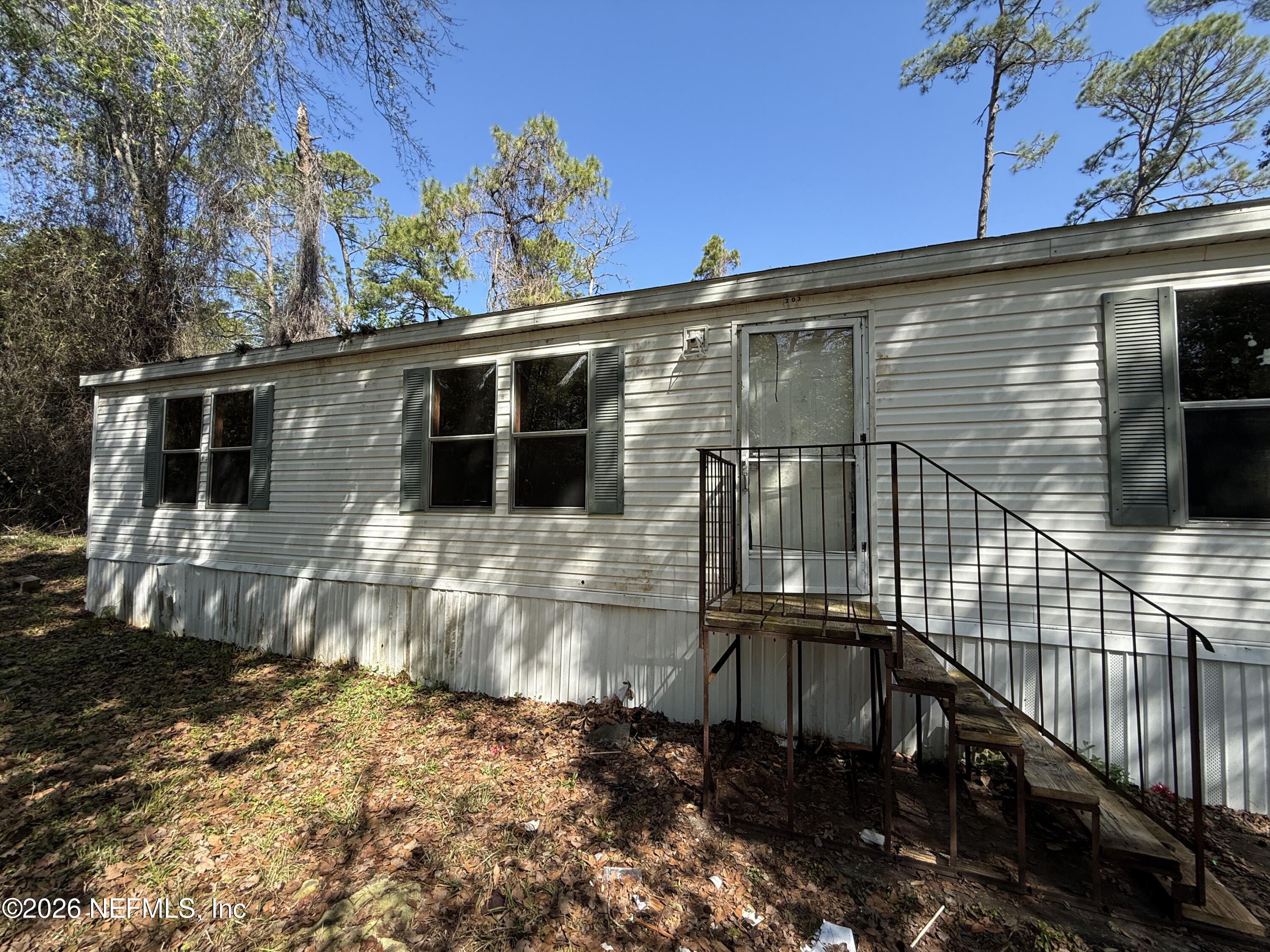 203 Quail Hollow Road Satsuma, FL 32189 - Photo 6 of 15 a view of a house with a balcony