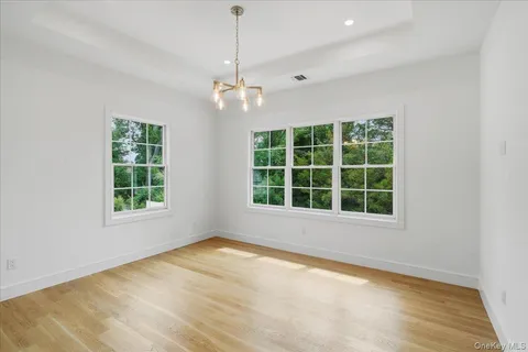 a view of a chandelier fan and a chandelier fan in a room