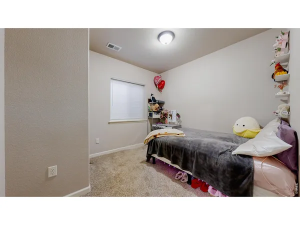 a bathroom with a sink a toilet a mirror and shower