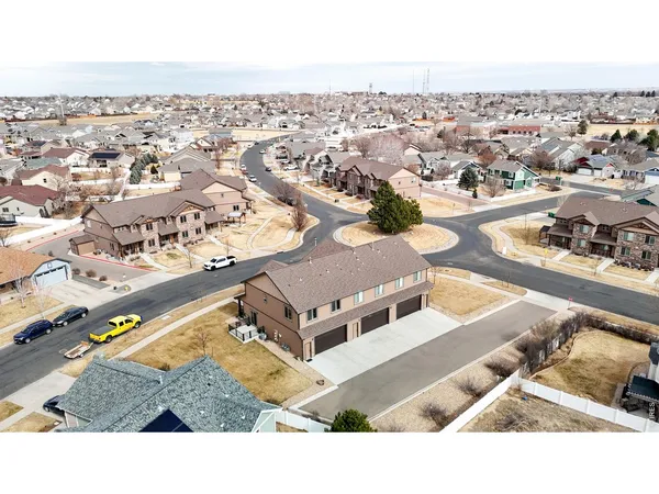 a terrace with outdoor seating and city view