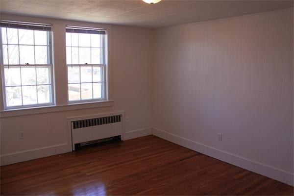 75 Jericho Road Scituate, MA 02066 - Photo 12 of 19 an empty room with wooden floor and windows