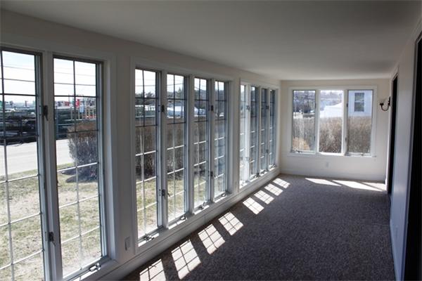 75 Jericho Road Scituate, MA 02066 - Photo 4 of 19 a view of an empty room with windows
