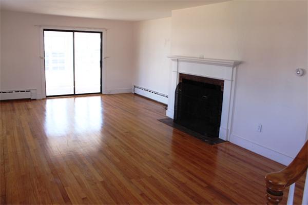 75 Jericho Road Scituate, MA 02066 - Photo 7 of 19 an empty room with wooden floor and windows