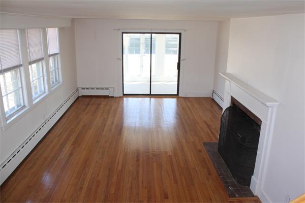 75 Jericho Road Scituate, MA 02066 - Photo 9 of 19 a view of an empty room with wooden floor and a window