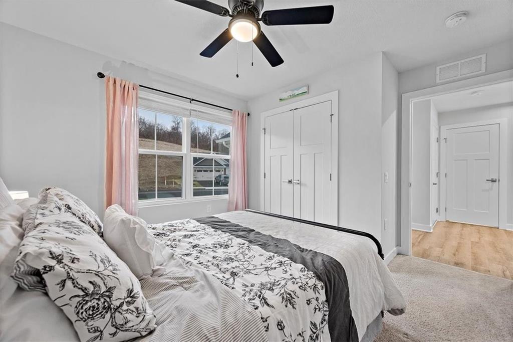718 Celia Way Harmony, PA 16037 - Photo 11 of 23 a bedroom with a large bed and a window