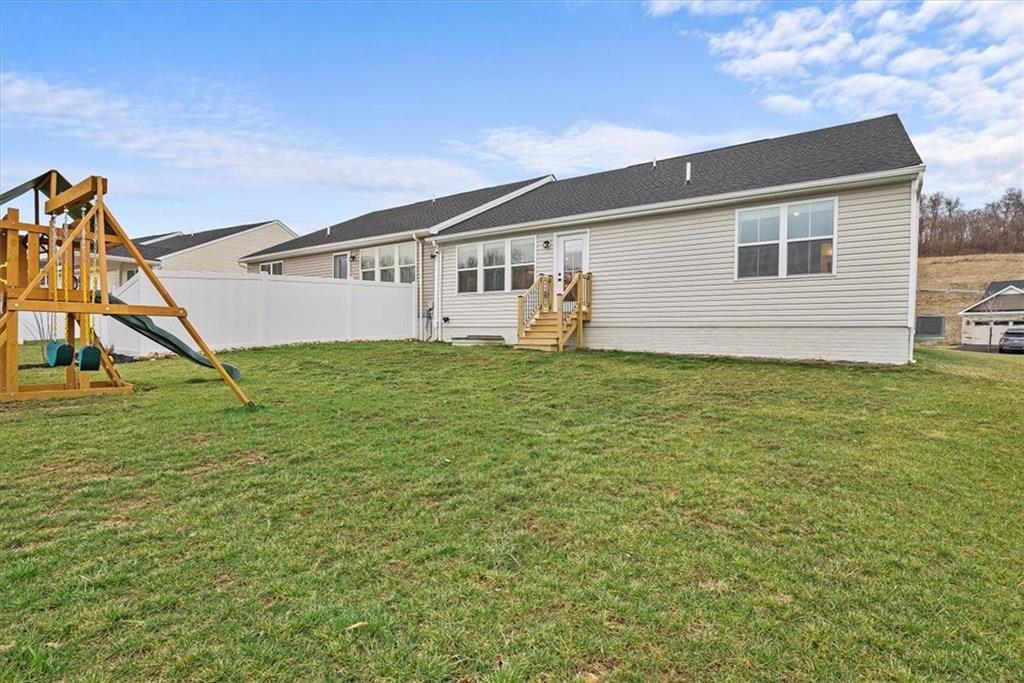 718 Celia Way Harmony, PA 16037 - Photo 18 of 23 a front view of a house with a yard