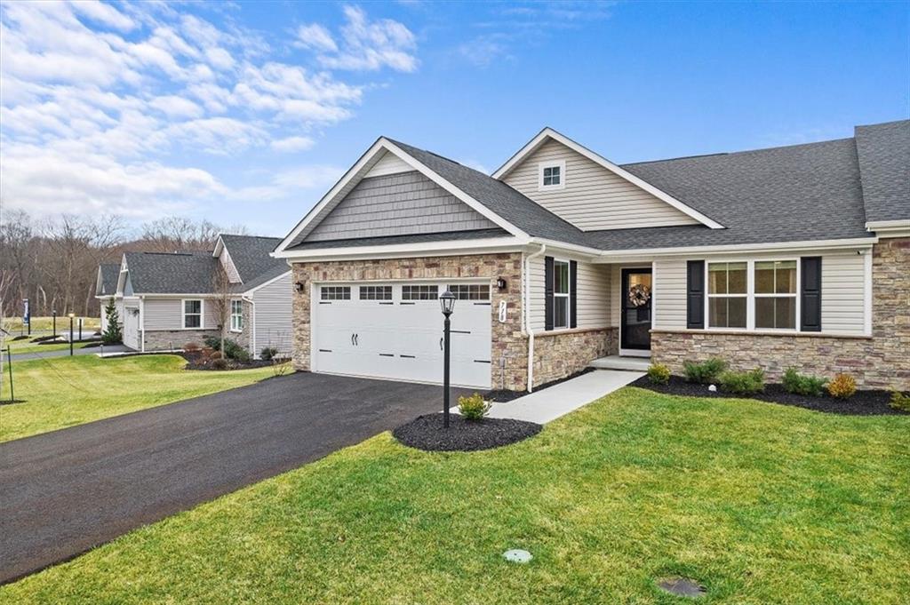 718 Celia Way Harmony, PA 16037 - Photo 2 of 23 a front view of a house with a yard and porch