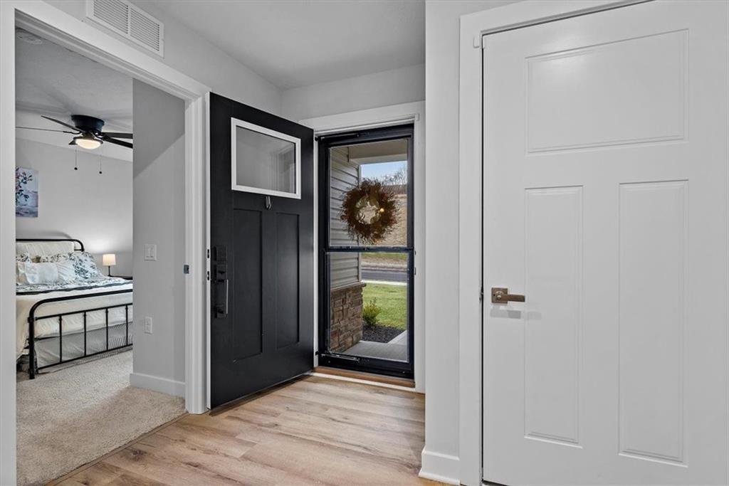 718 Celia Way Harmony, PA 16037 - Photo 4 of 23 a view of a walk in closet and bathroom
