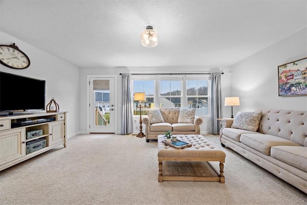 718 Celia Way Harmony, PA 16037 - Photo 8 of 23 a living room with furniture and a flat screen tv