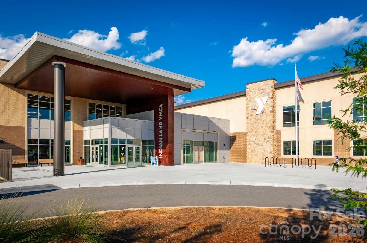 2188 Flicker Road, Unit 1036E Indian Land, SC 29707 - Photo 16 of 17 a view of a building with a street