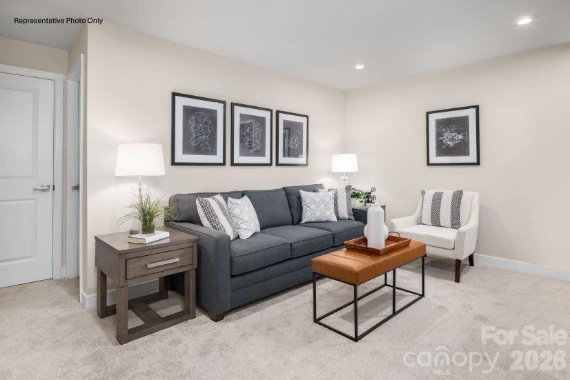 2188 Flicker Road, Unit 1036E Indian Land, SC 29707 - Photo 8 of 17 a living room with furniture and a table