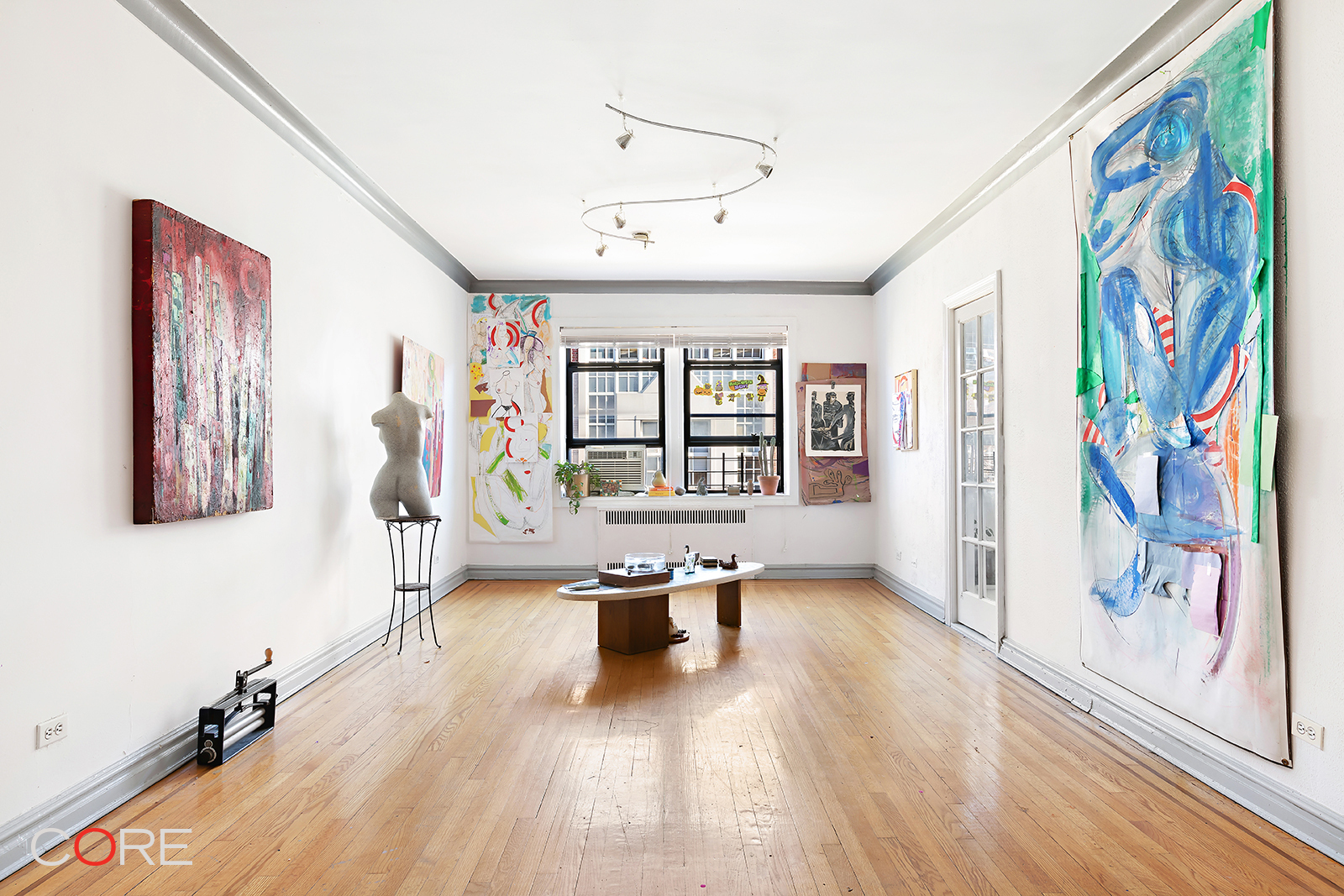 34-24 82nd Street, Unit 4N Queens, NY 11372 - Photo 2 of 10 a living room with furniture bathtub and a window