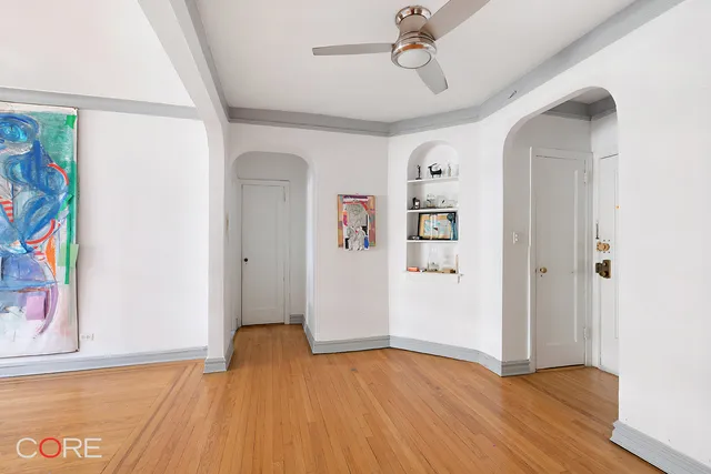 a view of an entryway with wooden floor