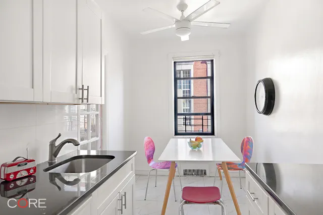 a kitchen with a sink cabinets and entryway
