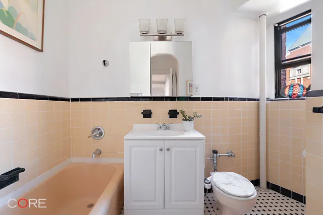a bathroom with a sink a toilet and a bathtub