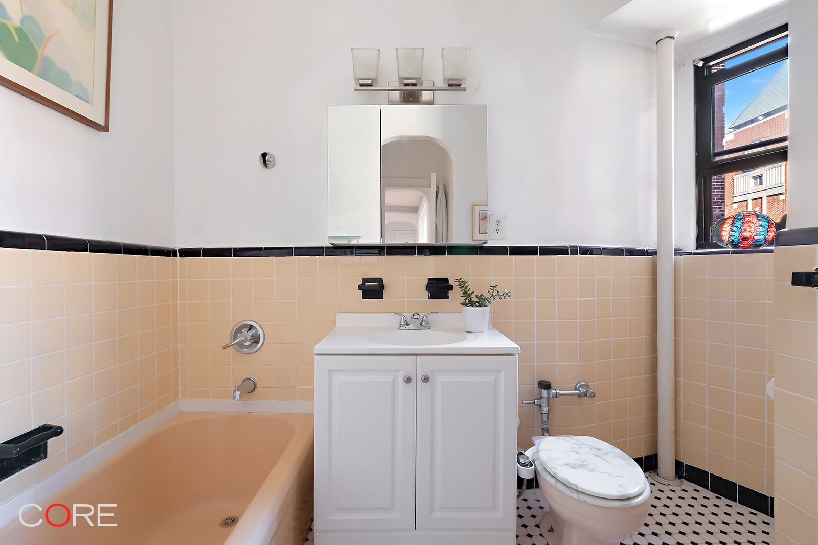 34-24 82nd Street, Unit 4N Queens, NY 11372 - Photo 7 of 10 a bathroom with a sink a toilet and a bathtub