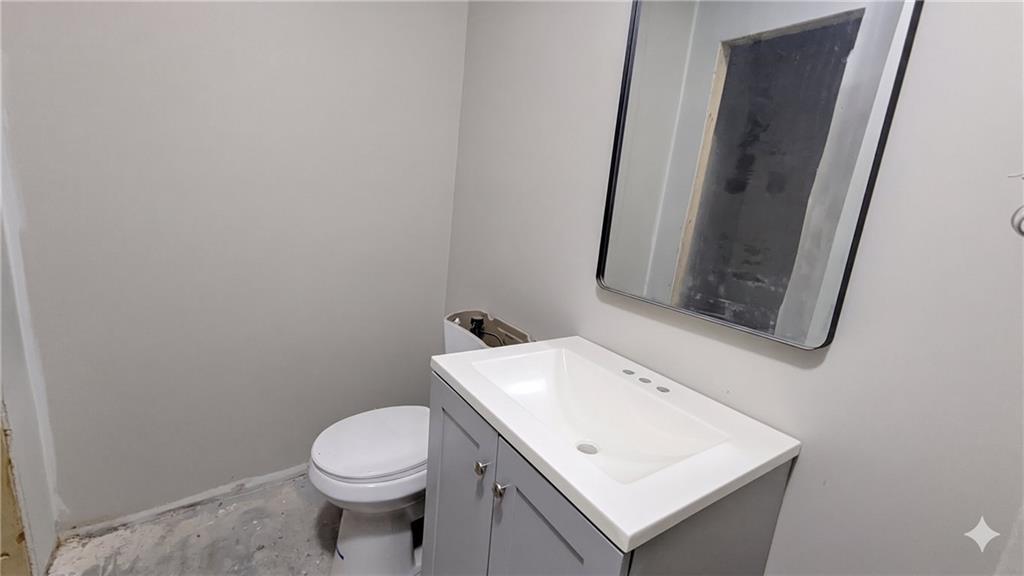 665 Lexington Avenue Southwest Atlanta, GA 30310 - Photo 29 of 33 a white toilet sitting next to a bathroom sink