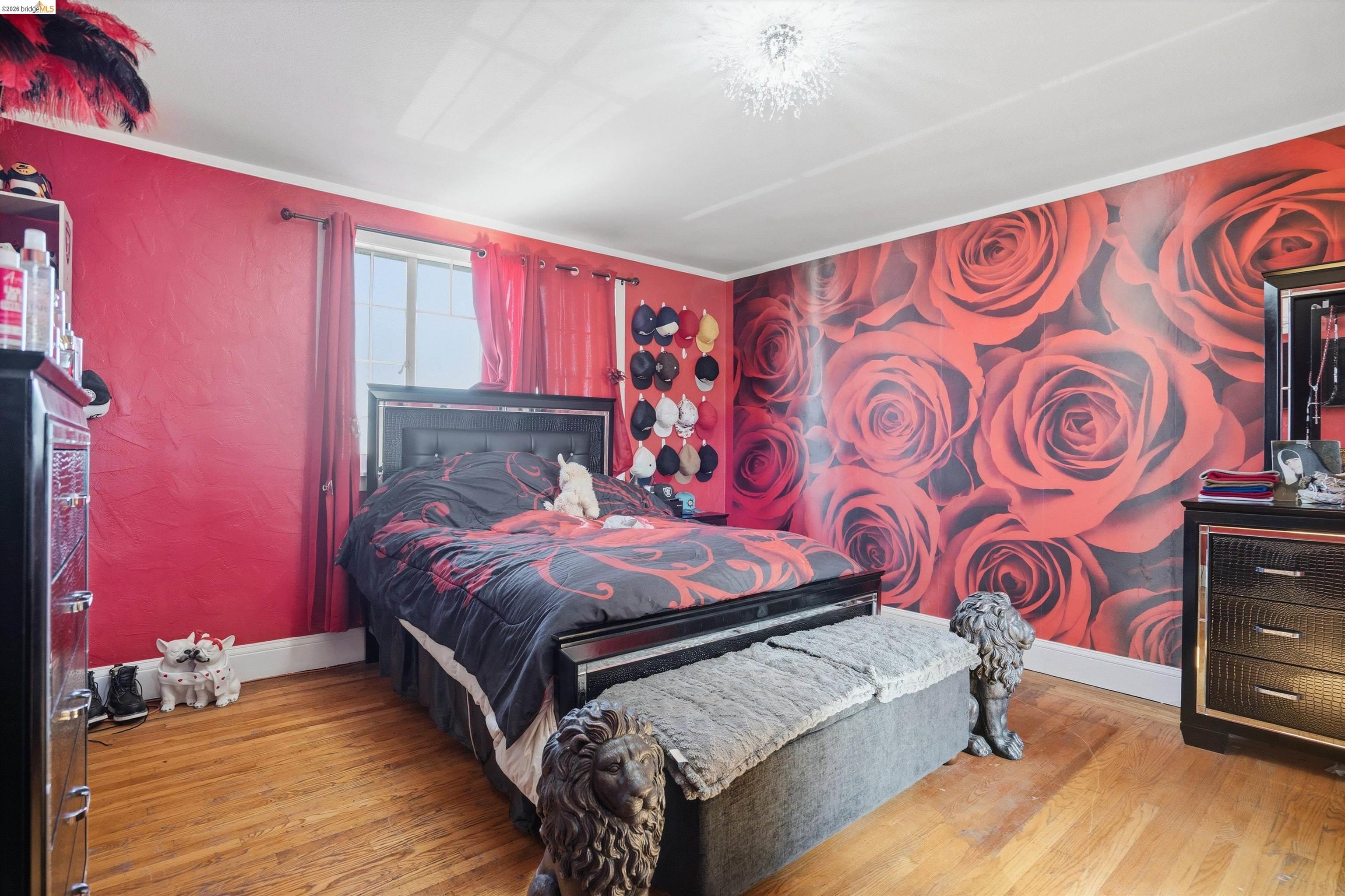 511 Third Street Rodeo, CA 94572 - Photo 5 of 25 a bedroom with a bed and wooden floor