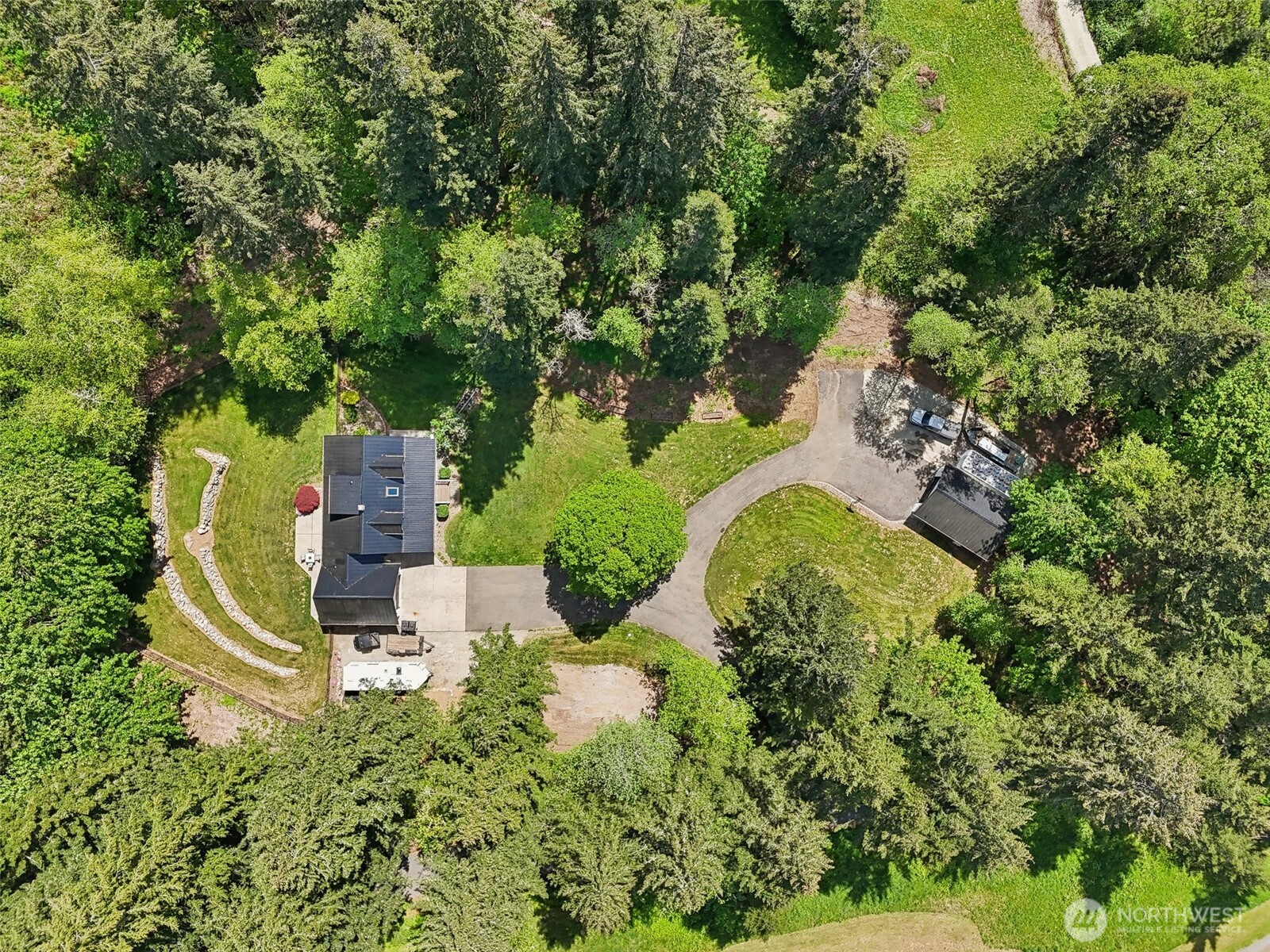 an aerial view of a house with a yard
