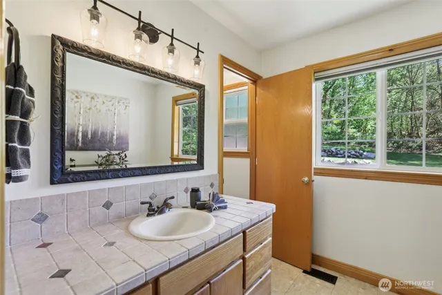 a bathroom with a sink and a mirror