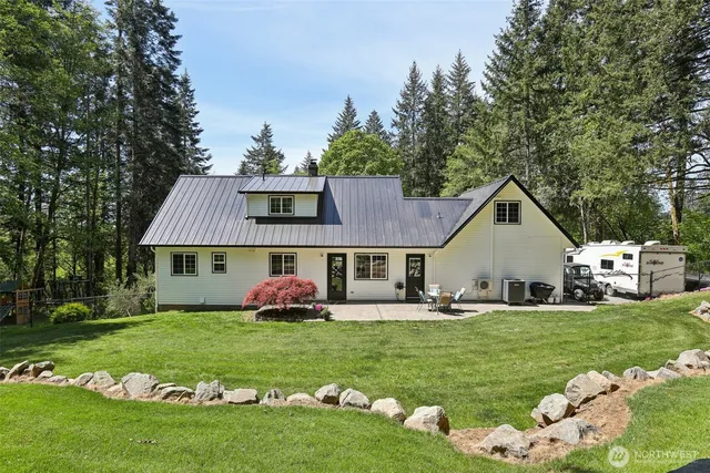 a view of a table and chairs in the garden