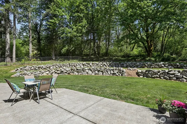 a house view with a seating space and garden