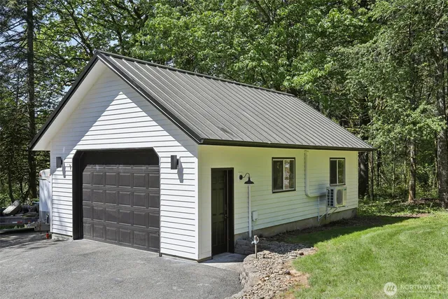 a view of a city with lush green forest