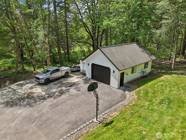 a aerial view of a house with a yard