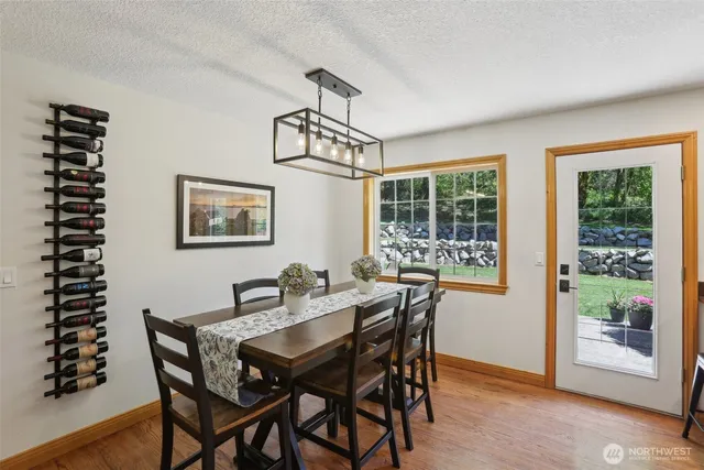 a view of a dining room with furniture window and wooden floor