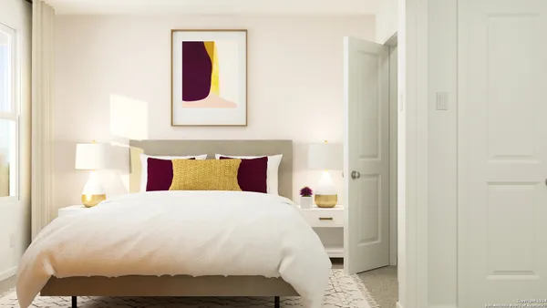 a bedroom with a bed and painting on the wall