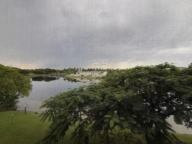 a kitchen with stainless steel appliances a refrigerator sink and cabinets