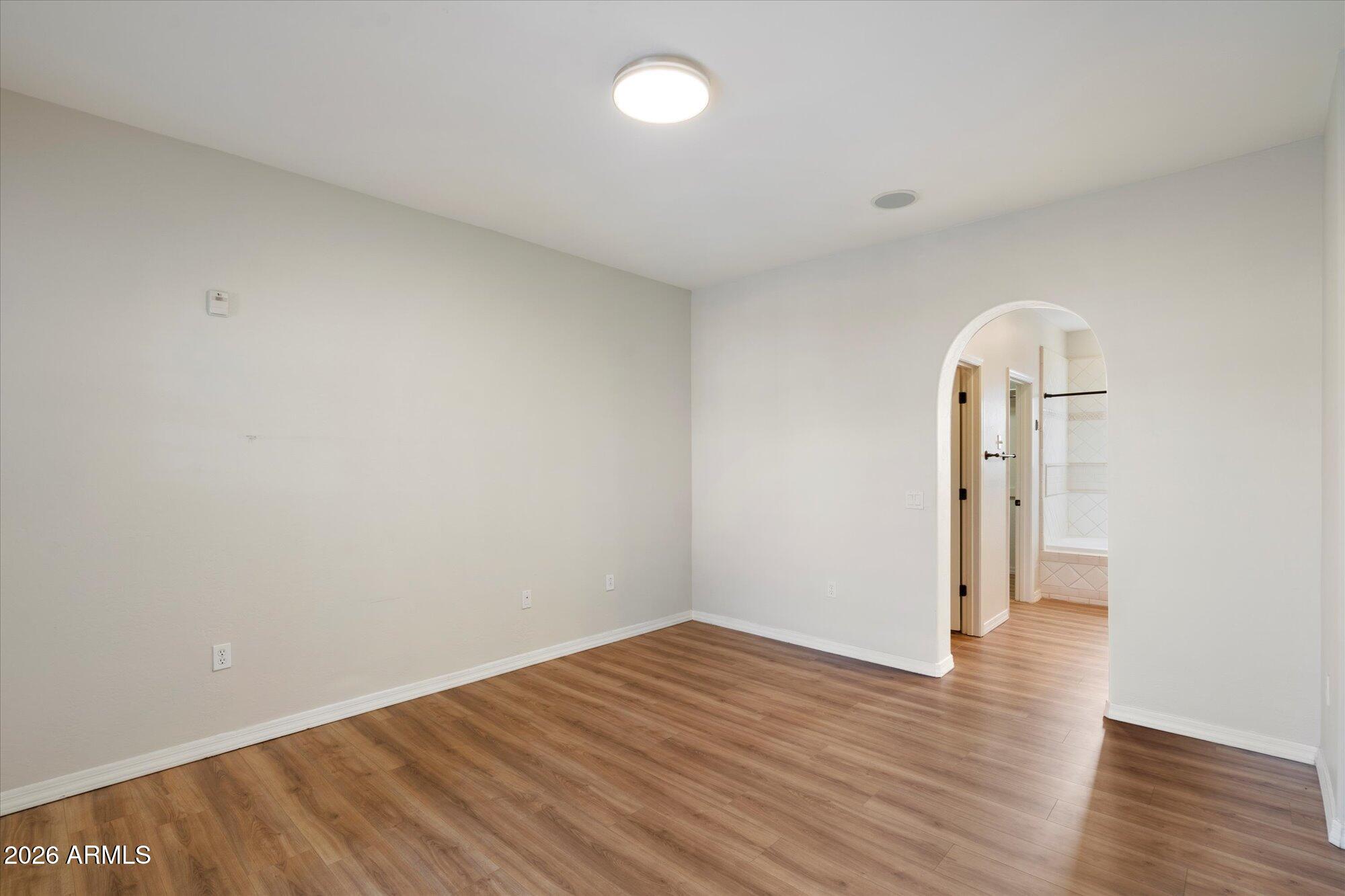 3935 East Rough Rider Road, Unit 1034 Phoenix, AZ 85050 - Photo 7 of 25 Primary bedroom