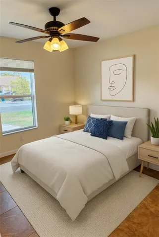 a bedroom with bed and window