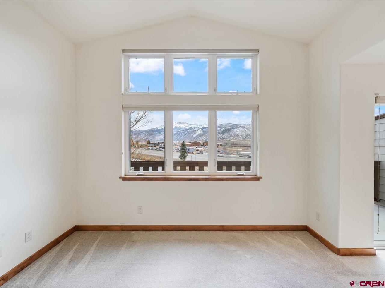 550 Redcliff Circle, Unit D202 Ridgway, CO 81432 - Photo 12 of 29 an empty room with a window