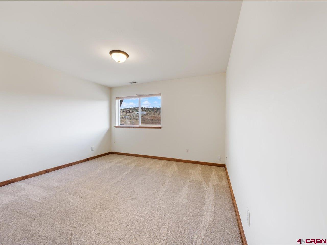 550 Redcliff Circle, Unit D202 Ridgway, CO 81432 - Photo 19 of 29 an empty room with a window